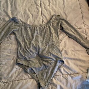 Small grey off the shoulder long sleeve body suit.